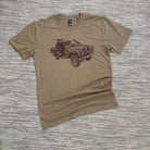 A beige colored t-shirt with a graphic print of a vehicle on the front.
