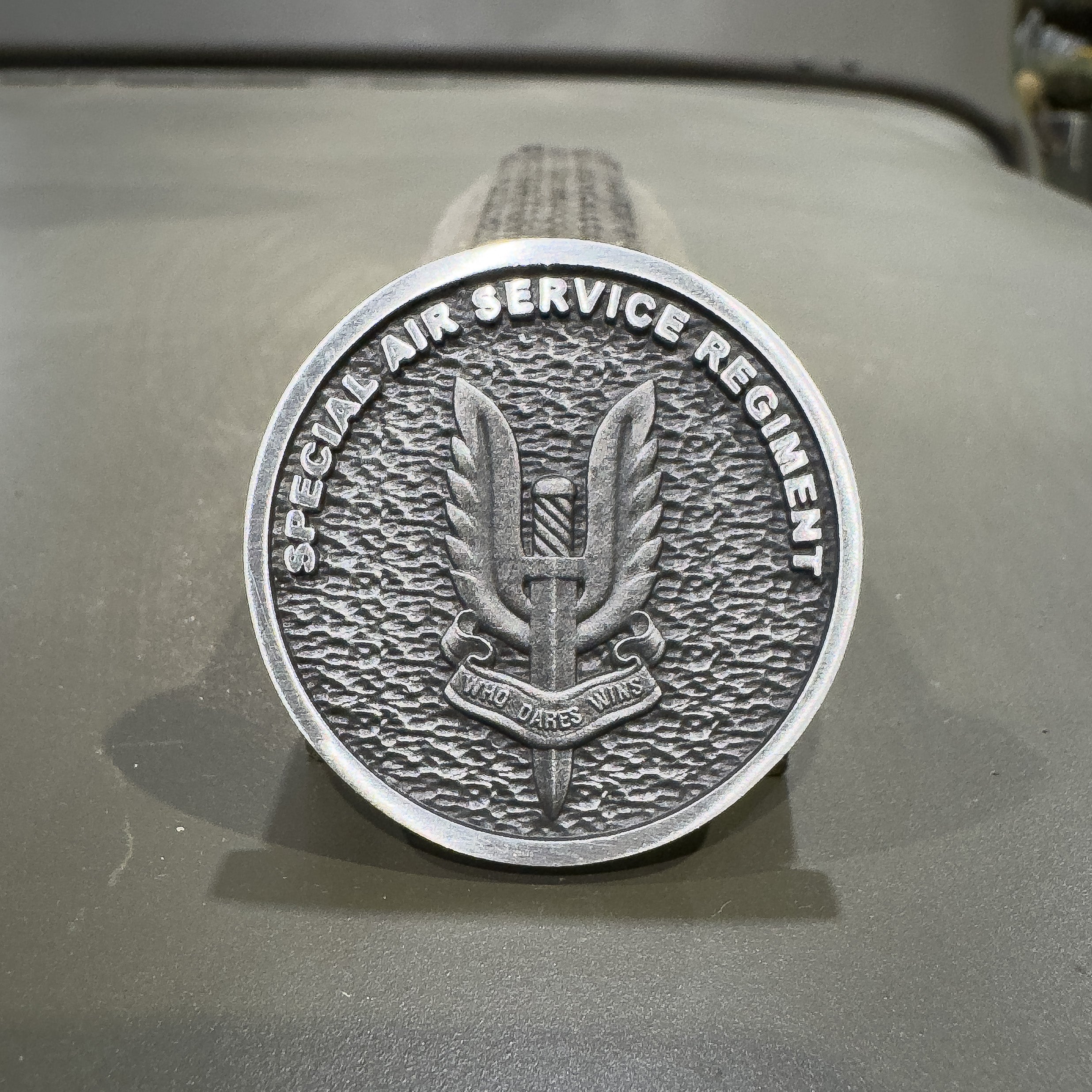 Australian SAS challenge coin with Special Air Service Regiment emblem and motto on textured background