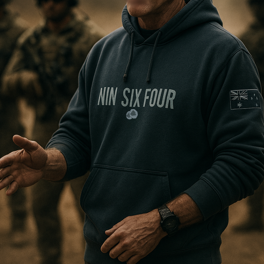 Man wearing official SAS merchandise hoodie by NINESIXFOUR in navy blue with front logo and patch