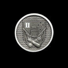 ninesixfour metal challenge coin with crossed pistols and helmet emblem on textured background