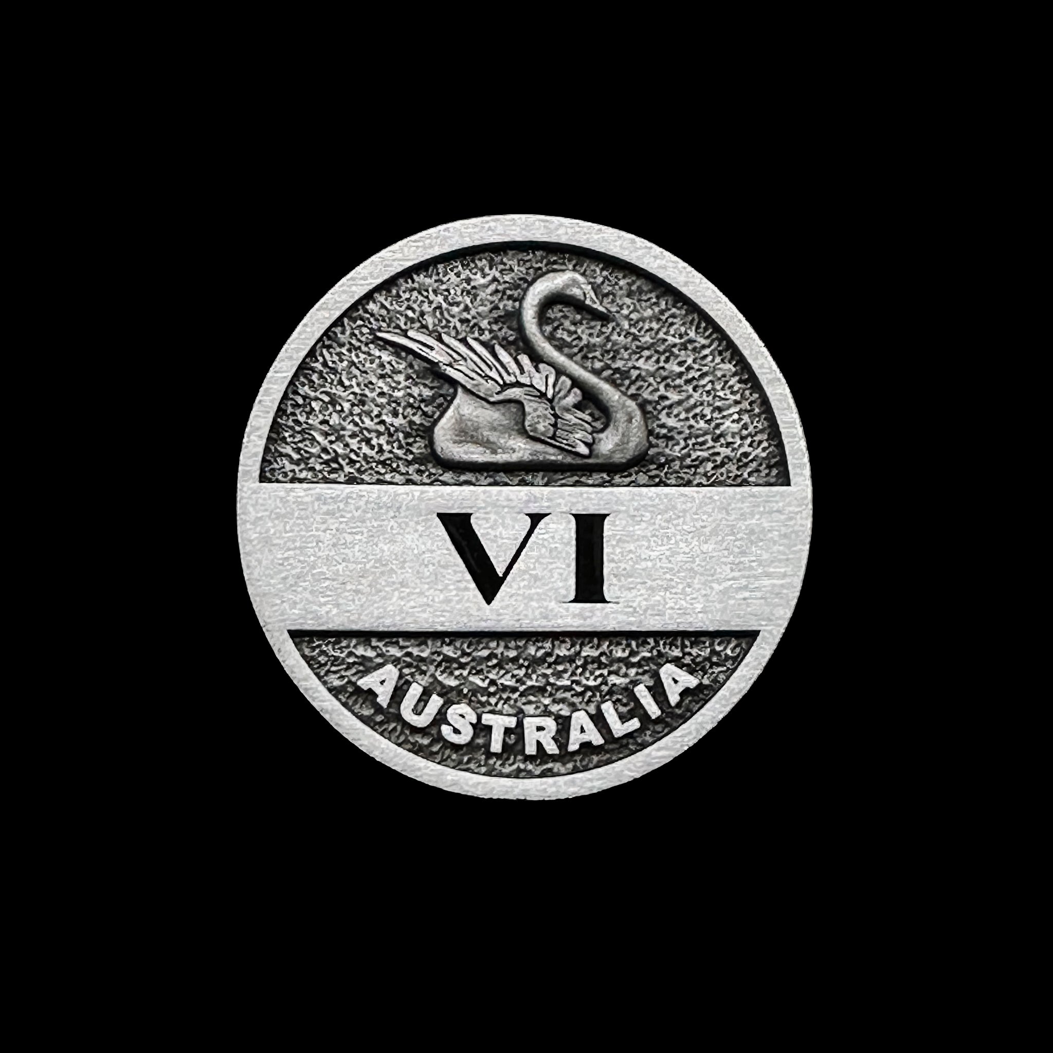 Antique silver coin with swan design, VI numeral and Australia inscription