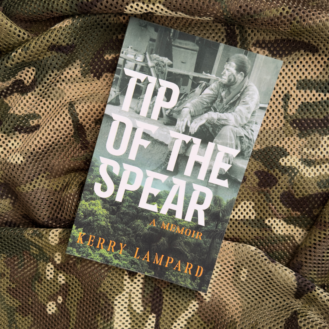 Tip of the Spear memoir by Kerry Lampard with a soldier seated on a camouflaged background