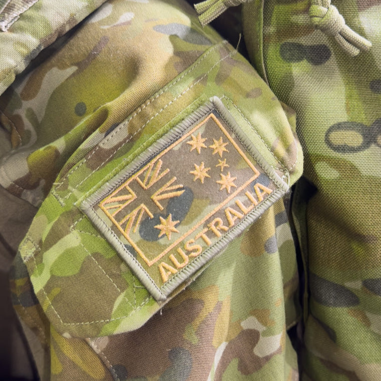 Camouflage military sleeve with an Australian flag patch