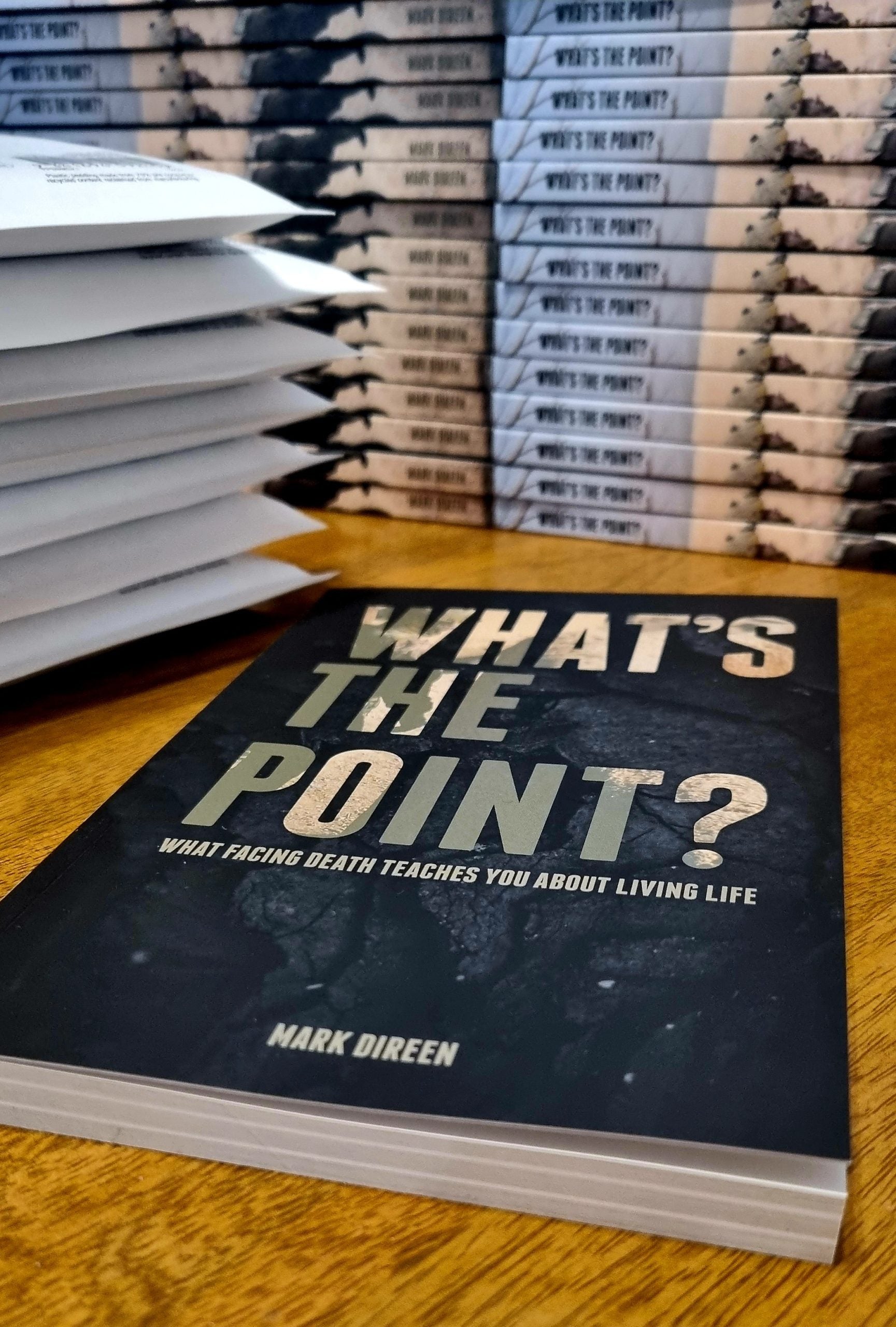 Signed SAS book titled Whats The Point by Mark Direen stacked with envelopes ready for shipping