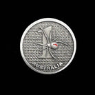 ninesixfour Australia one dollar coin with redback spider design and textured background