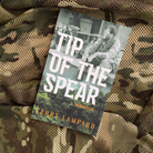 Tip of the Spear memoir by Kerry Lampard with a soldier seated on a camouflaged background